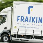 A Fraikin delivery truck in motion on a road, with the company's logo and slogan "You Drive, We Care" visible on the side.