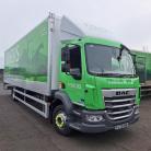 A green and white Fishers laundry service truck parked outdoors. The truck features the company's logo and website, fisherslaundry.co.uk, on its side along with an image of a stag.