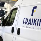 The image shows a white Fraikin van in the foreground with the company logo and slogan "You Drive, We Care" on its side. In the background, there is a DAF truck inside a garage or warehouse setting.