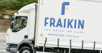 A Fraikin delivery truck in motion on a road, with the company's logo and slogan "You Drive, We Care" visible on the side.