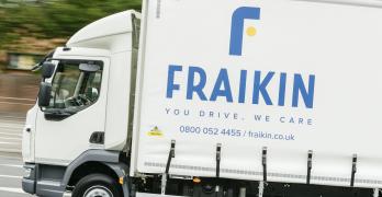 A Fraikin delivery truck in motion on a road, with the company's logo and slogan "You Drive, We Care" visible on the side.